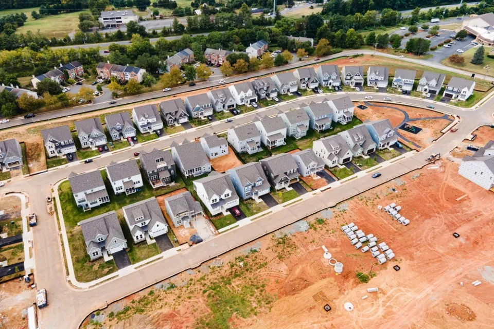 Aerial view of dense single-family homes in neighborhood still under construction